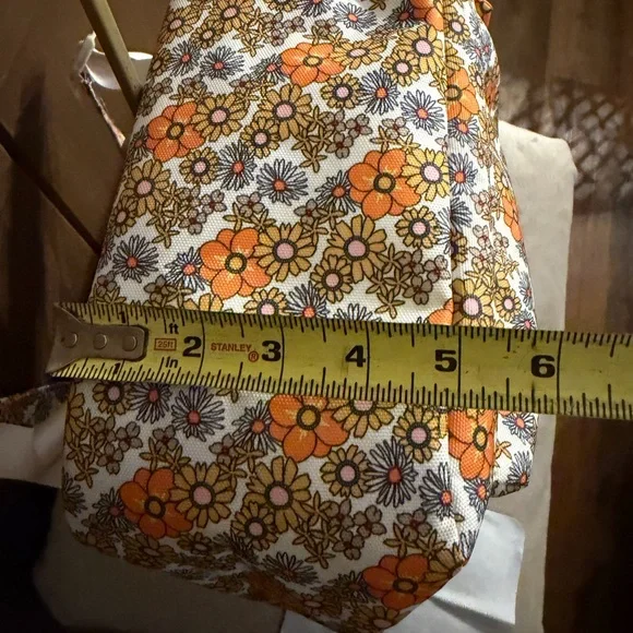 Add some color to your wardrobe with this Floral Orange and Yellow Backpack. - Picture 10 of 10